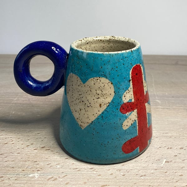 Navy donut handle abstract design ceramic mug.