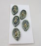 5 Small Leaf Shaped Forest Green Ceramic Buttons - Image 1