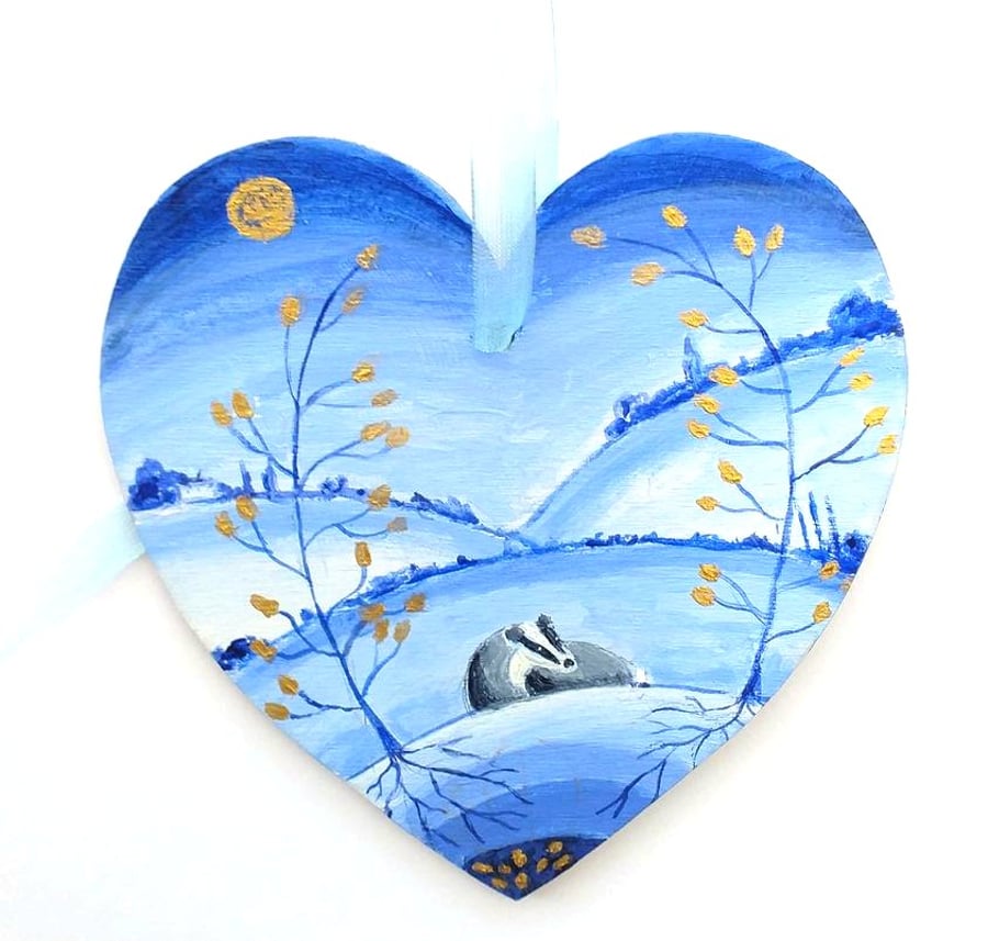Badger with golden leaved trees  on a wooden heart shape 