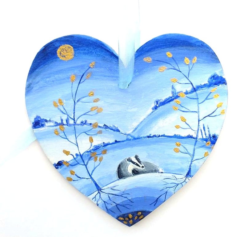 Badger with golden leaved trees  on a wooden heart shape 