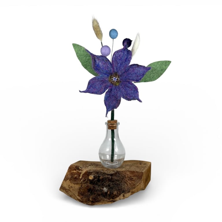 Everlasting Felt flower decoration in glass bottle vase in purple