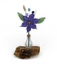 Everlasting Felt flower decoration in glass bottle vase in purple