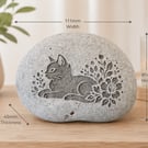 Decorative engraved cat with lovely patterns on stone