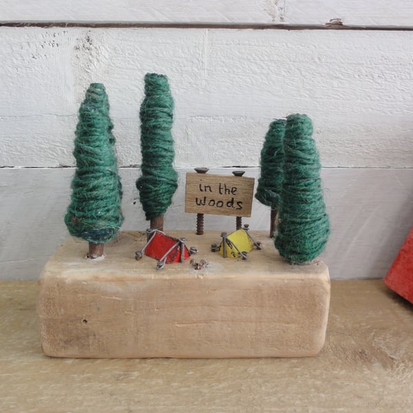 Little wooden tent in miniature camping scene of reclaimed materials