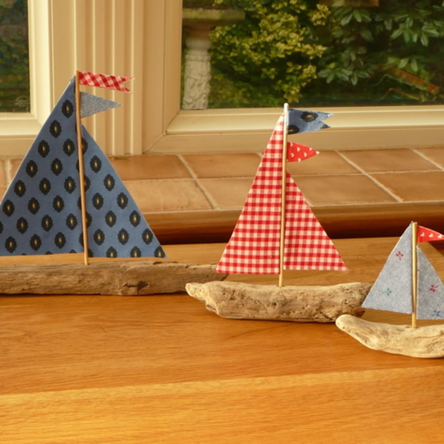 Trio of driftwood boats