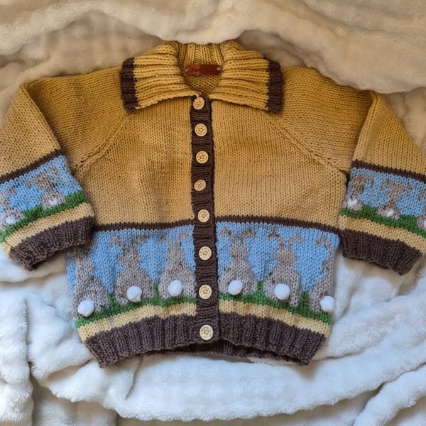 Handknit fairisle children's cardigan with pom pom bunnies