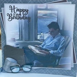 Chilled and relaxed man reading Happy birthday card