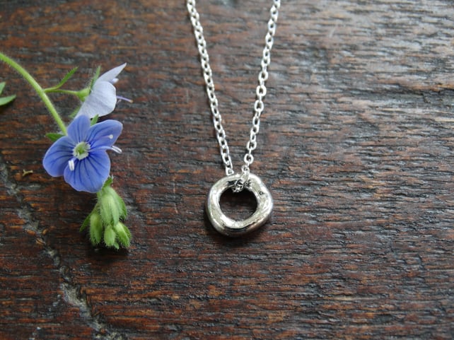 Tiny hagstone charm pendant - molten recycled sterling silver 