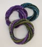 Felted cord bracelet in shades of purple