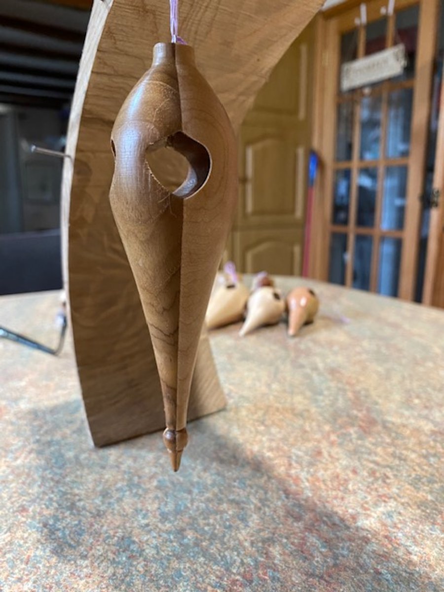 Long Walnut and Beech wood Christmas tree decoration.