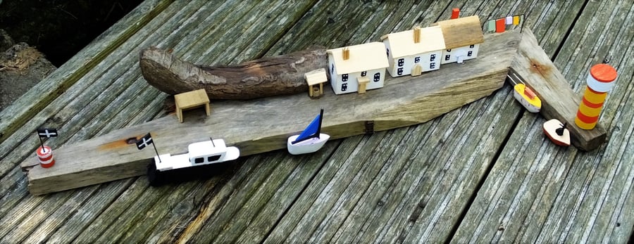 Terrace of cottages on harbour wall from recycled wood & Cornish driftwood  