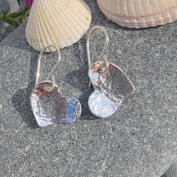 Sterling silver hammered heart earrings.