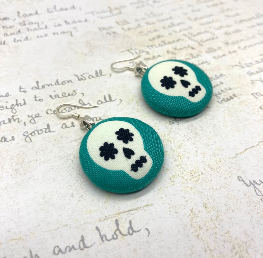 Skulls on aqua fabric button statement earrings Halloween inspired