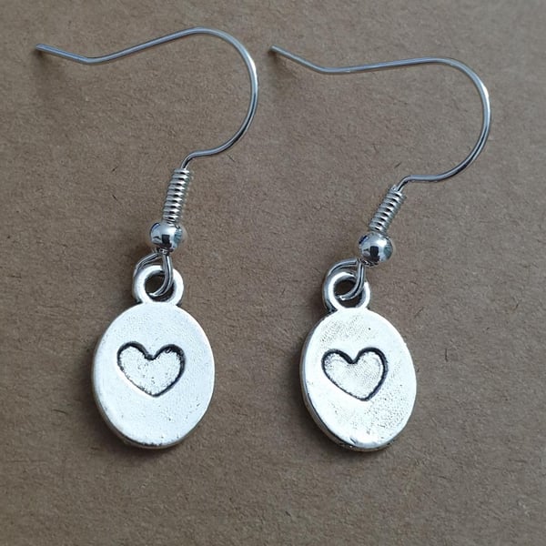 silver plated earrings with mini oval charms featuring debossed hearts