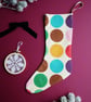 Medium Christmas Stocking in Cream with Large Rainbow POlka Dot Print - Image 1