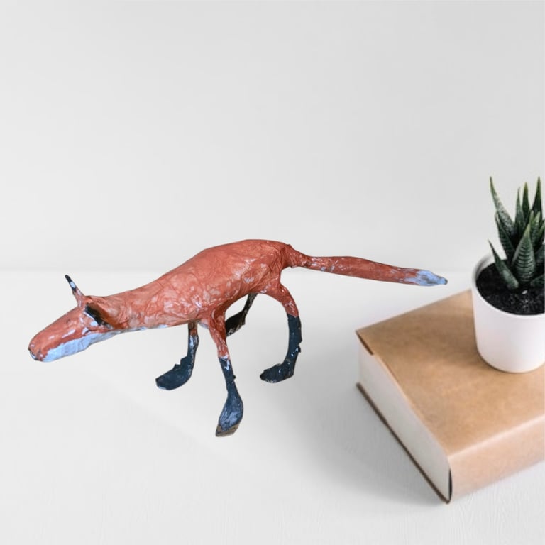 Handmade paper mache fox sculptures