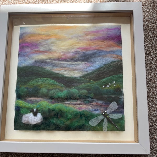 Sunset over the moors, lake reflections with a sheep and a dragon fly 