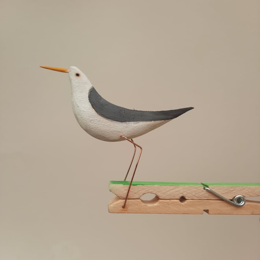 Pecking peg bird