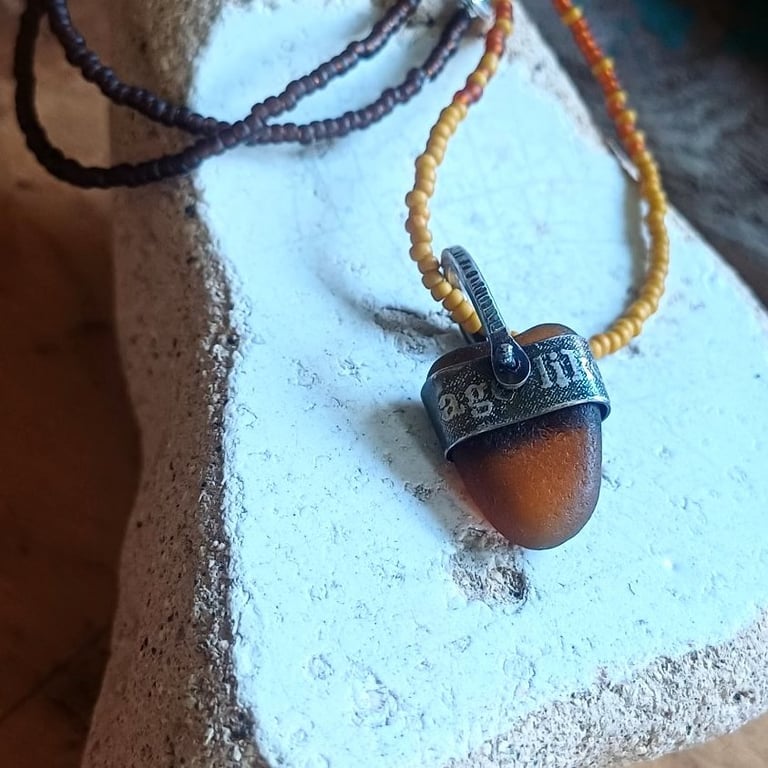 Brown-beer sea glass, silver and seed-bead swivel necklace pendant.