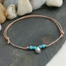 Adjustable cotton cord anklet with turquoise beads and shell charm
