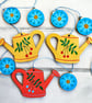 Wooden garland with watering cans and flowers – gift for gardeners garden lovers