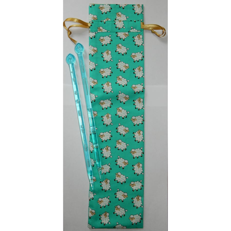 Knitting needle case or storage sheep on green