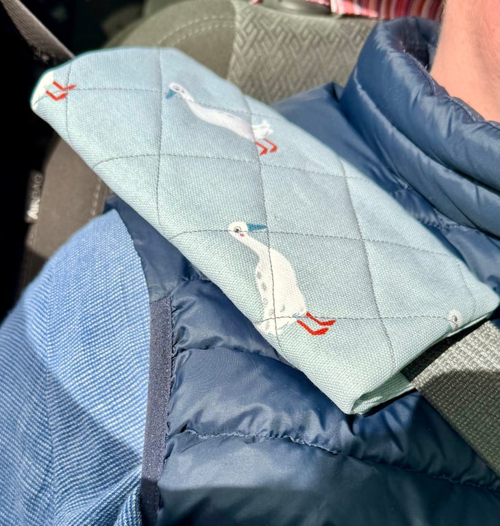 Pair of quilted seatbelt pads - runner ducks with red feet and blue beak
