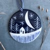 Ceramic Winter scene hanging decoration.