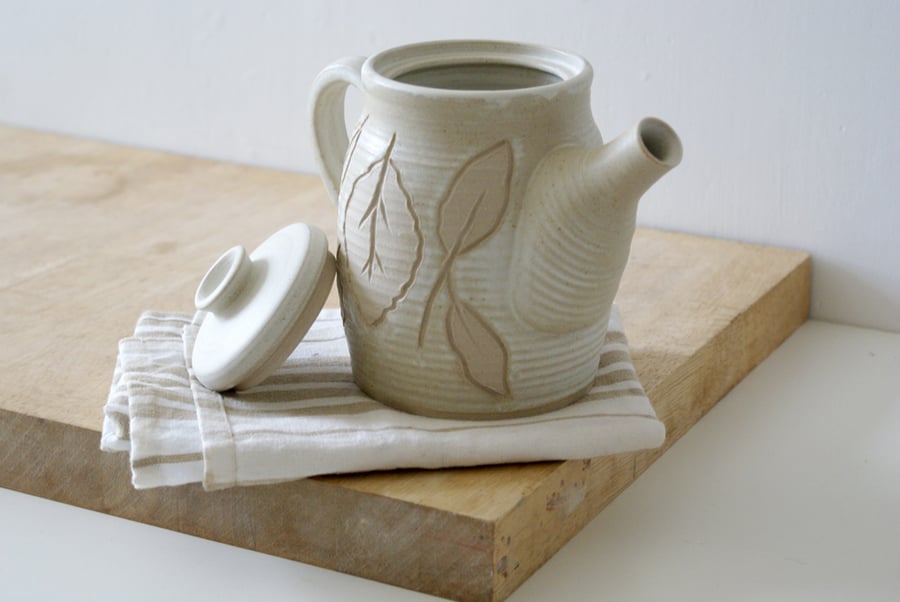 Hand thrown stoneware coffee pot - glazed in vanila cream with leaf pattern