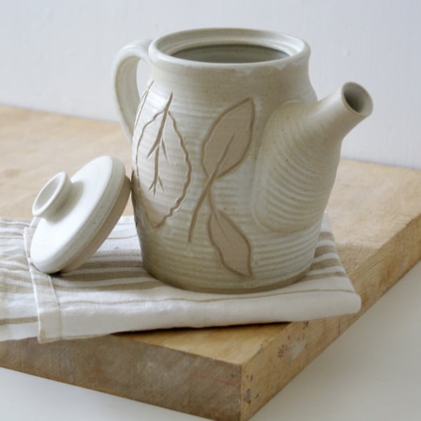 Hand thrown stoneware coffee pot - glazed in vanila cream with leaf pattern