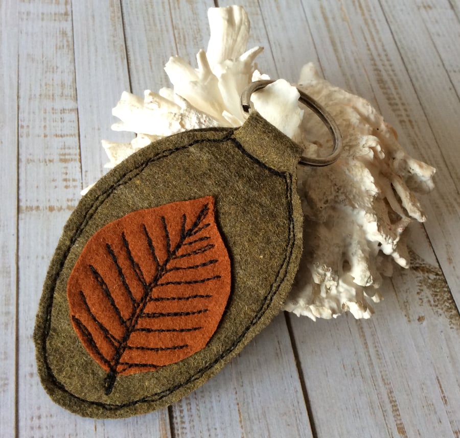 Up-cycled embroidered leaf key ring. 