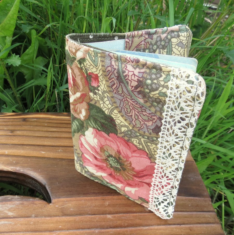 A fabric passport cover.  Sanderson fabric with vintage lace.