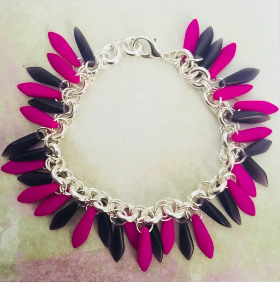 Vibrant neon and deep purple dagger bead bracelet