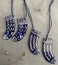 Set of four ceramic sock decorations . - Image 1