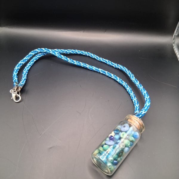 Handmade Blue Braided Necklace with Bead filled bottle pendant