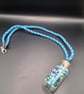 Handmade Blue Braided Necklace with Bead filled bottle pendant