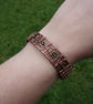 Woven zigzag copper cuff with green beads - Image 4