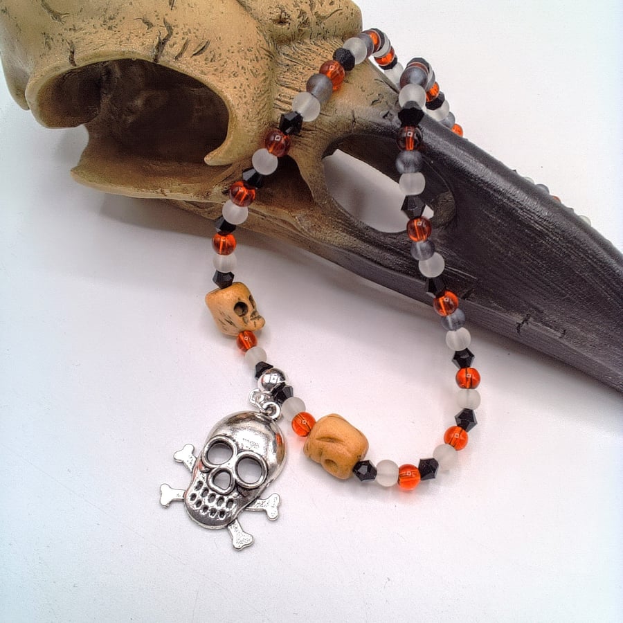 Skull & Crossbones Pendant on a Red Black and White Necklace, Halloween