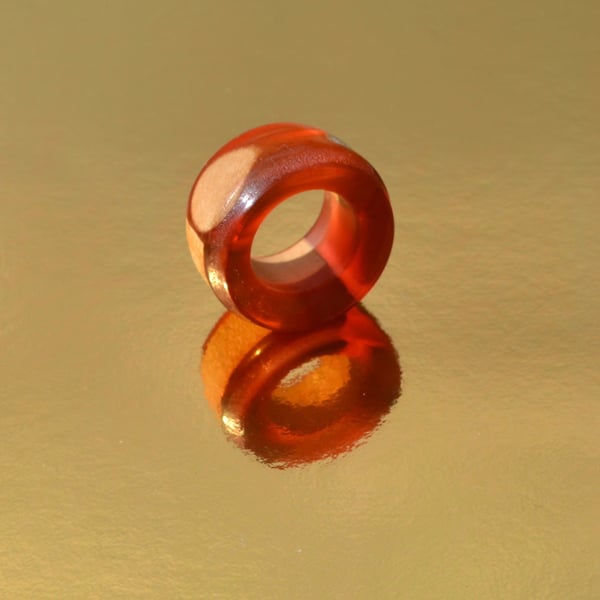 Epoxy Resin finger ring with wood inserts.