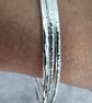 Set of three silver stacking bangles - Image 3