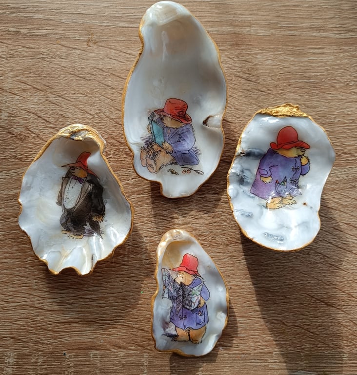 Four paddington bear hand-finished oyster shells 