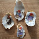 Four paddington bear hand-finished oyster shells 