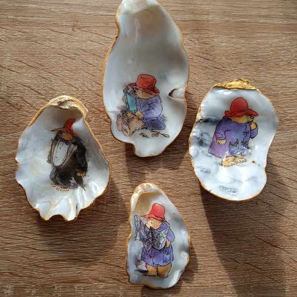 Four paddington bear hand-finished oyster shells 