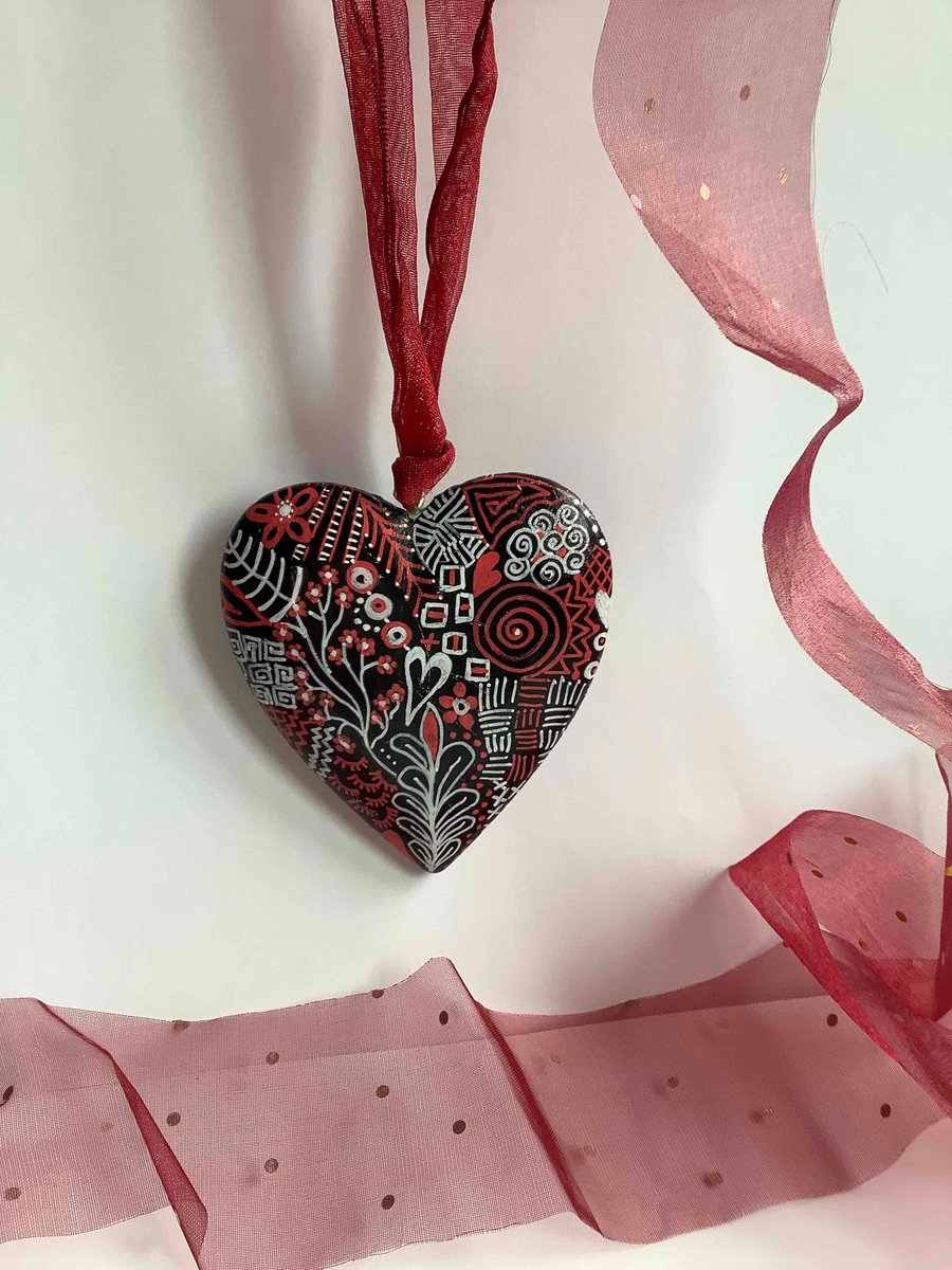 Red, black and white abstract wooden heart