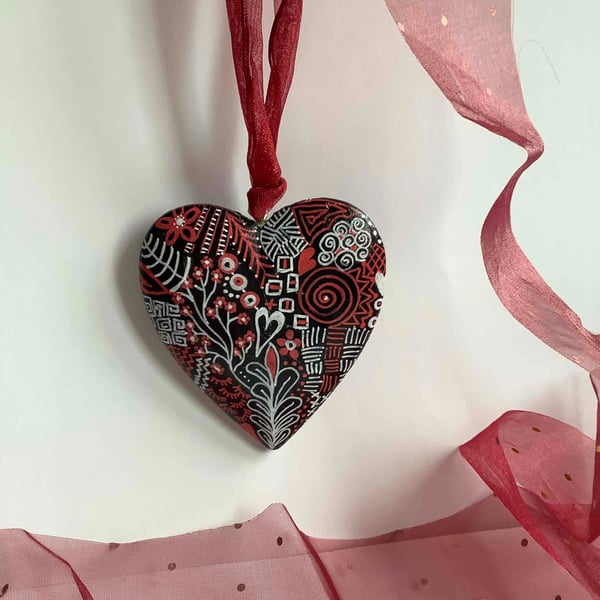 Red, black and white abstract wooden heart