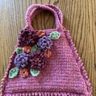 Flowery crochet handbag in raspberry pink
