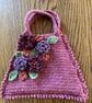 Flowery crochet handbag in raspberry pink