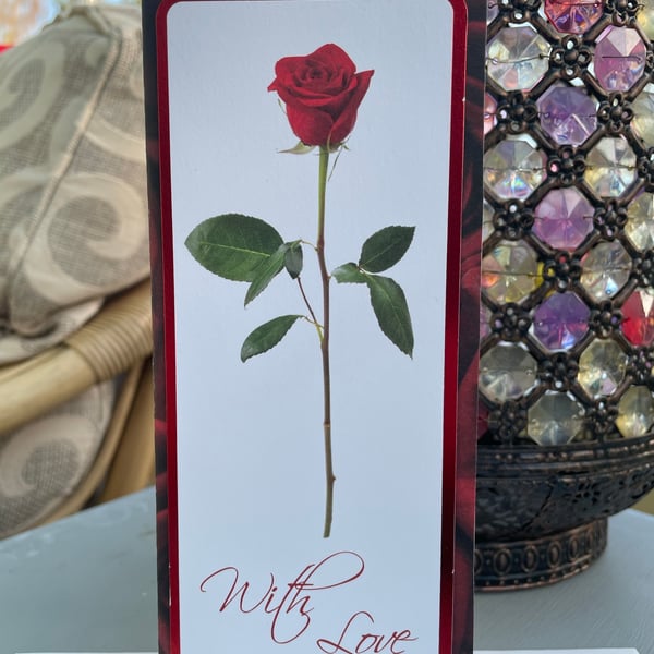 Single red rose with love anniversary or valentines card