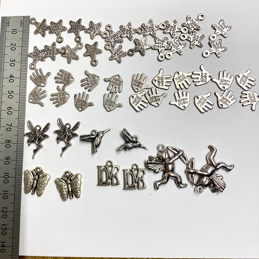 50 assorted alloy charms for crafting, jewellery