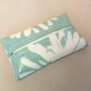 Turquoise tissue holder with daisy pattern, tissues included